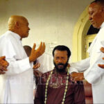 • The senior priests praying for Evangelist Ebuka Obi after his kind gesture.