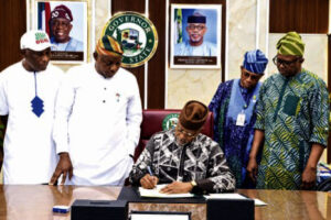 •Gov. Abiodun signing the Bill