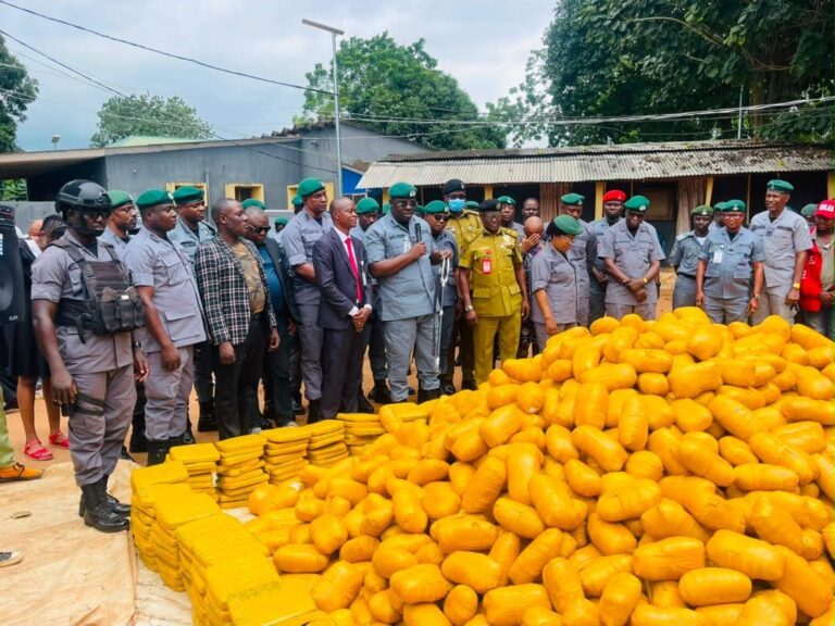 The Acting Customs Area Controller in charge of Ogun 1 Area Command, Oladapo Afeni, handing over seized parcels of narcotics to the officials of NDLEA, Idiroko Special Command