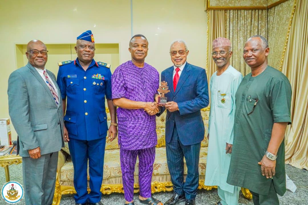 L-R Mr Brian Ojibe; Air Cde Adedoyin, Director Veterans Admin,NAF; Air Marshal S.K. Aneke, Chief of the Air Staff NAF; Captain August Okpe; Air Cde Sani Zachary (retd), Veterans Liaison Officer; Air Vice Marshal Garba Bello. On the occasion when the Nigerian Air Force High Command honored Captain August Okpe, the last surviving most senior pioneer Pilot of the NAF, for his contributions to the Military and Civil Aviation of Nigeria