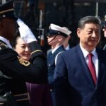 China’s President Xi Jinping and his wife Peng Liyuan walk past a US military honor guard on their way to board an Air China plane upon departure from Joint Base Andrews in Maryland on September 25, 2026. (Photo by Evelyn Hockstein / POOL / AFP)