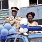 ACM Ogungbemide being pulled out of service at the FRSC headquarters, Abuja. With him is his wife, Ifeyinwa