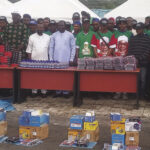 Chief of Staff to Senator Onyewuchi Ezenwa, Chika Emerald Alozie (3rd left), in a group photograph with the beneficiaries