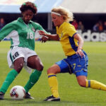 Patience Avre of Nigeria kicks the ball away from midfielder Anna Sjoestroem of Sweden during the FIFA Women’s World Cup at Crew Stadium on September 28, 2003 in Columbus, Ohio. (Photo- AFP)