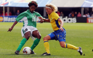 Patience Avre of Nigeria kicks the ball away from midfielder Anna Sjoestroem of Sweden during the FIFA Women’s World Cup at Crew Stadium on September 28, 2003 in Columbus, Ohio. (Photo- AFP)