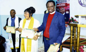 Prophet Ayorinde (right) after consecrating two ministers in Malabo,Equatorial Guinea during the visit.