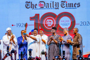 Secretary to the Government of the Federation,  George Akume, (3rd L) displaying a plaque as important dignitaries applauded in admiration at the unveiling of The Nigerian Grand Book at the DTN@100 Centenary Celebration in Abuja