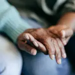 young-woman-holding-elderly-hands