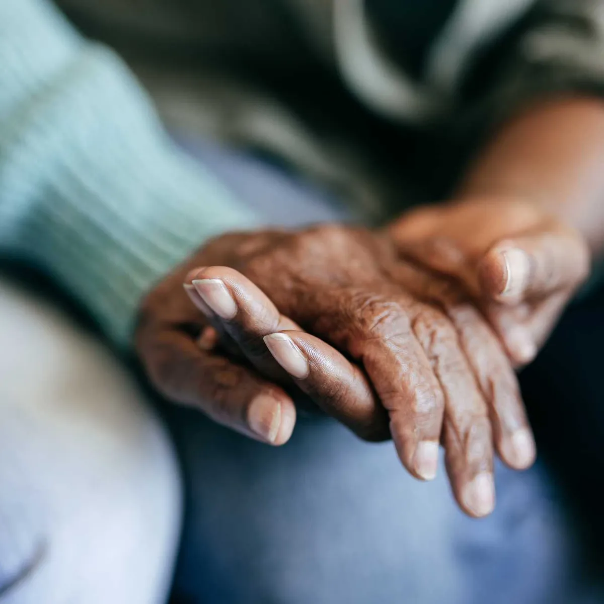 young-woman-holding-elderly-hands