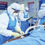 Health workers treating a patient. Photo- AI-generated