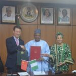 The Chinese Ambassador to Nigeria, Yu Dunhai (l), the Minister of Budget and Economic Planning, Abubakar Atiku Bagudu (m) and the Minister of State, Budget and Economic Planning, Doris Uzoka-Anite, during the signing of a two hundred million yuan grant agreement for the implementation of projects under the Nigeria-China Development Cooperation Agreement in Abuja.