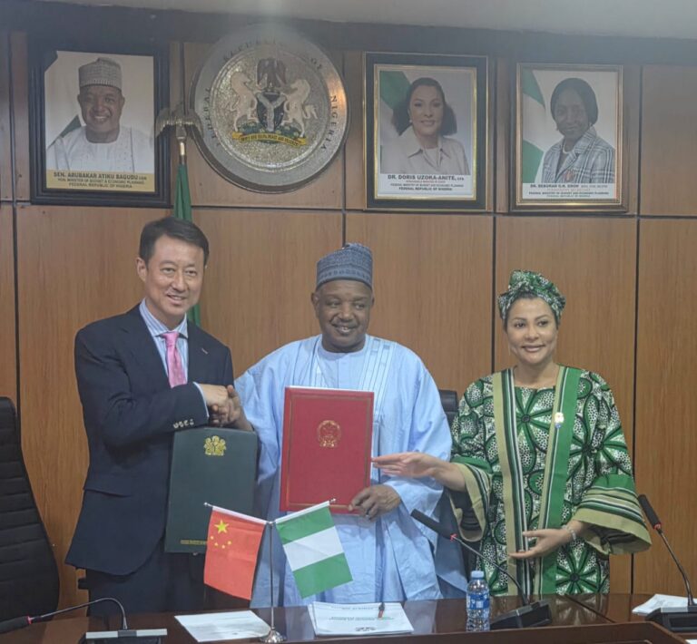 The Chinese Ambassador to Nigeria, Yu Dunhai (l), the Minister of Budget and Economic Planning, Abubakar Atiku Bagudu (m) and the Minister of State, Budget and Economic Planning, Doris Uzoka-Anite, during the signing of a two hundred million yuan grant agreement for the implementation of projects under the Nigeria-China Development Cooperation Agreement in Abuja.