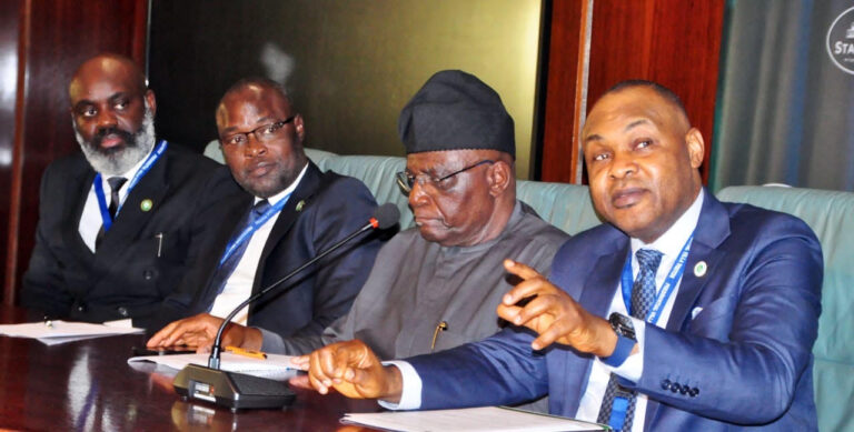 Managing Director and Chief Executive Officer of National Credit Guarantee Company (NCGC) Bonaventure Okhaimo, briefs State House Correspondents at the Press Gallery at the Presidential Villa while Special Adviser to the President on Information and Strategy, Bayo Onanuga and other members of NCGC delegation looked one