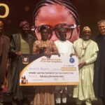 Sanwo-Olu (2nd left), Dr. Doro (3rd right), Dr. Alausa (2nd right), Mr. Boidin (right) present cheque to Mrs. Adeyemo (3rd left)