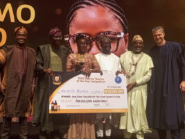Sanwo-Olu (2nd left), Dr. Doro (3rd right), Dr. Alausa (2nd right), Mr. Boidin (right) present cheque to Mrs. Adeyemo (3rd left)